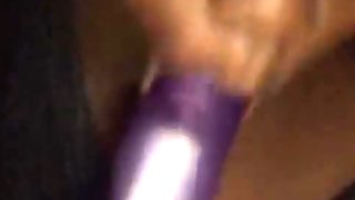 Ugly Ebony BBW sucking on purple dildo